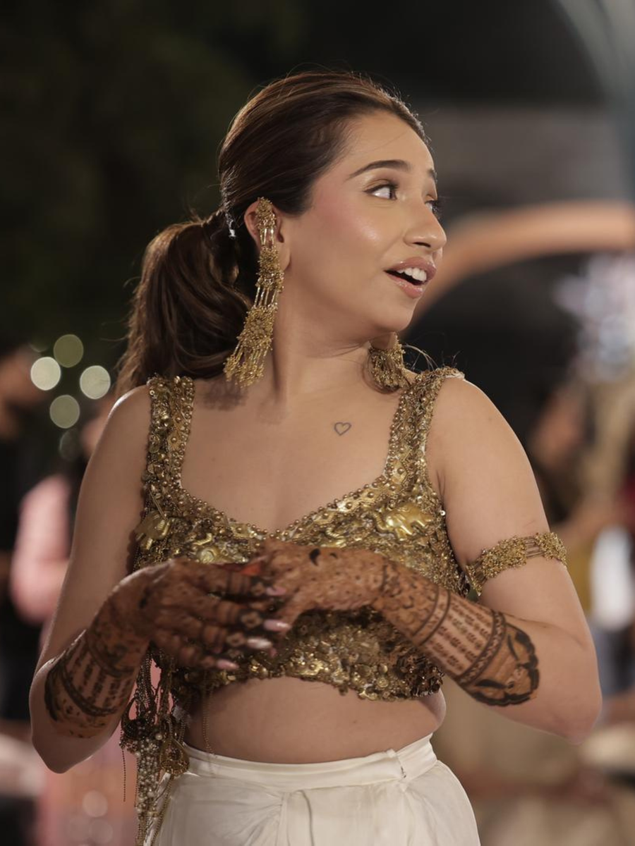 Urvi's Customised Gold armlet and earrings for sangeet